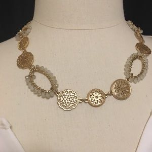 Gold beaded shirt statement necklace.